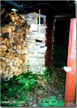 New Jersey Outhouse by the wood pile. Check out the Axe!