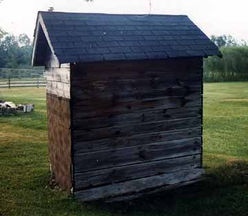 Back View of the Outhouse Showing the Holes