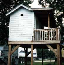 Side View of Elevated Outhouse Playhouse