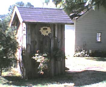 Back view of the outhouse