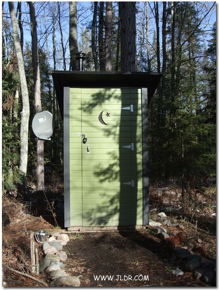 Front of Jay G's Outhouse with Moon and Star
