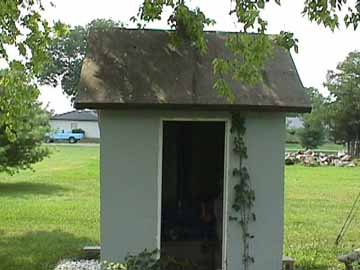 Front View of the Concrete Outhouse