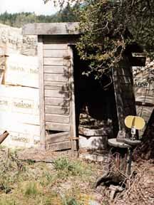 Front entrance showing corner seat in the outhouse