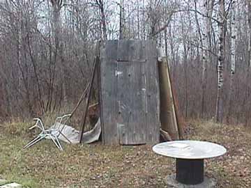 Popular Tree Framed Leaning Outhouse