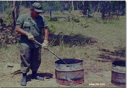 Burning excrement in Viet Nam behind the enemy lines; smoke could be seen for miles!